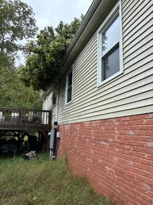trees fallen onto roof of home
