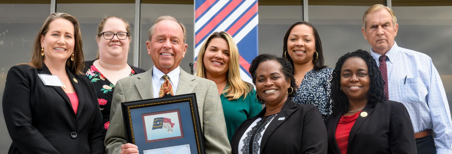 Group photo of Caswell Award recipient Lee Futrelle and other staff