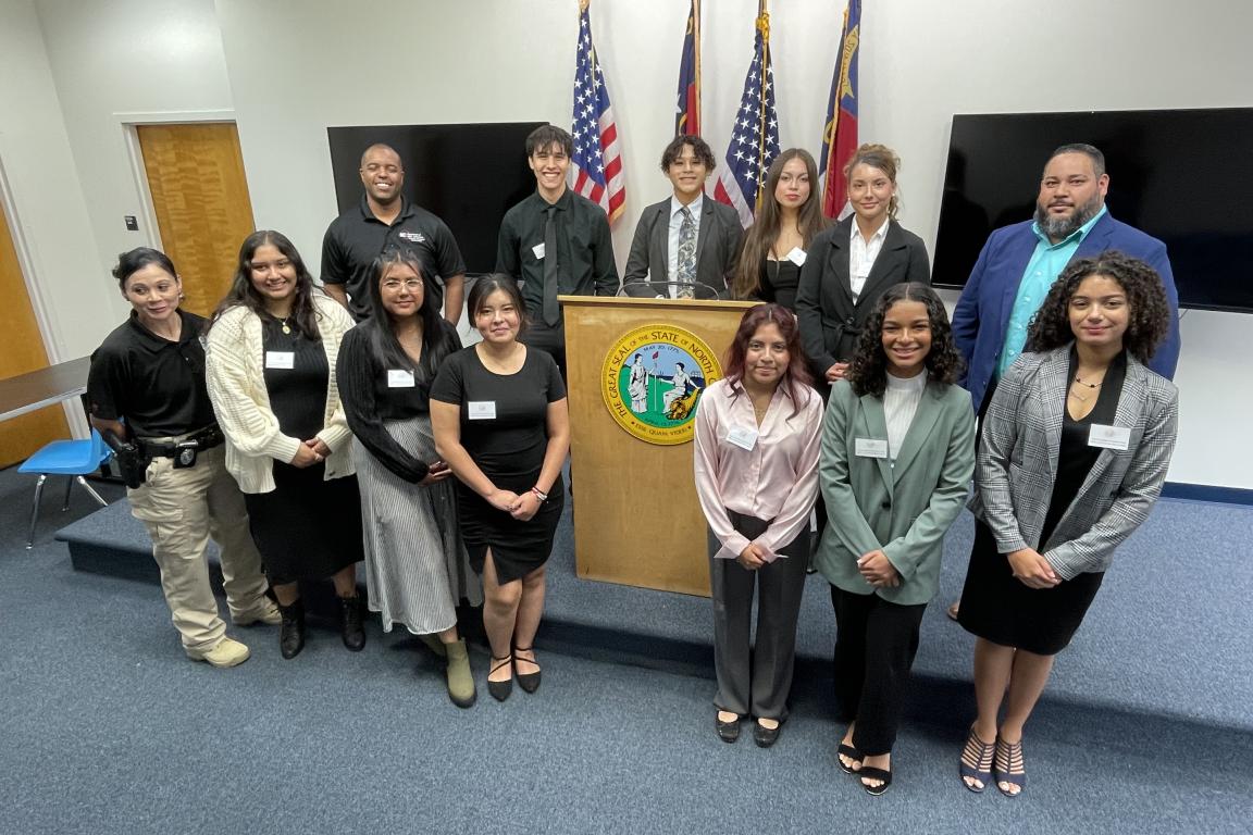high school students in front of podium
