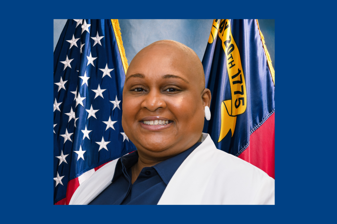 Black woman with white jacket - headshot