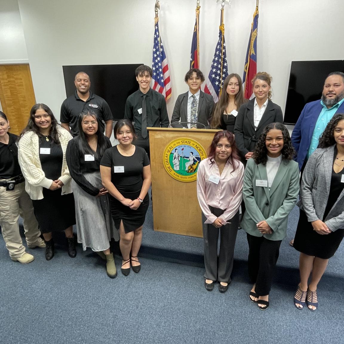 high school students in front of podium