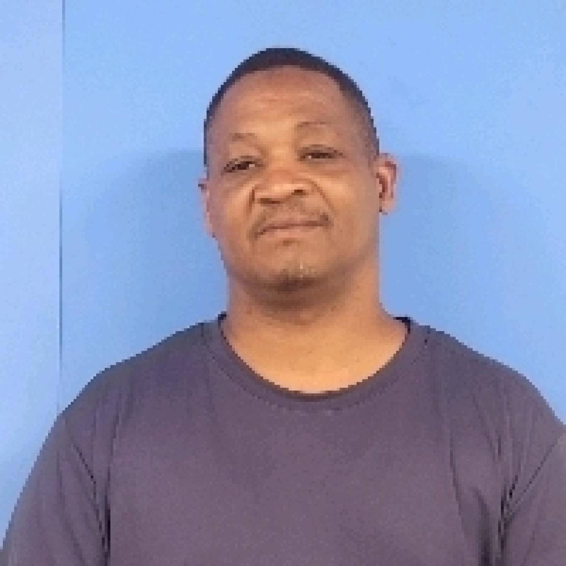 black man, overweight, middle-aged, no beard