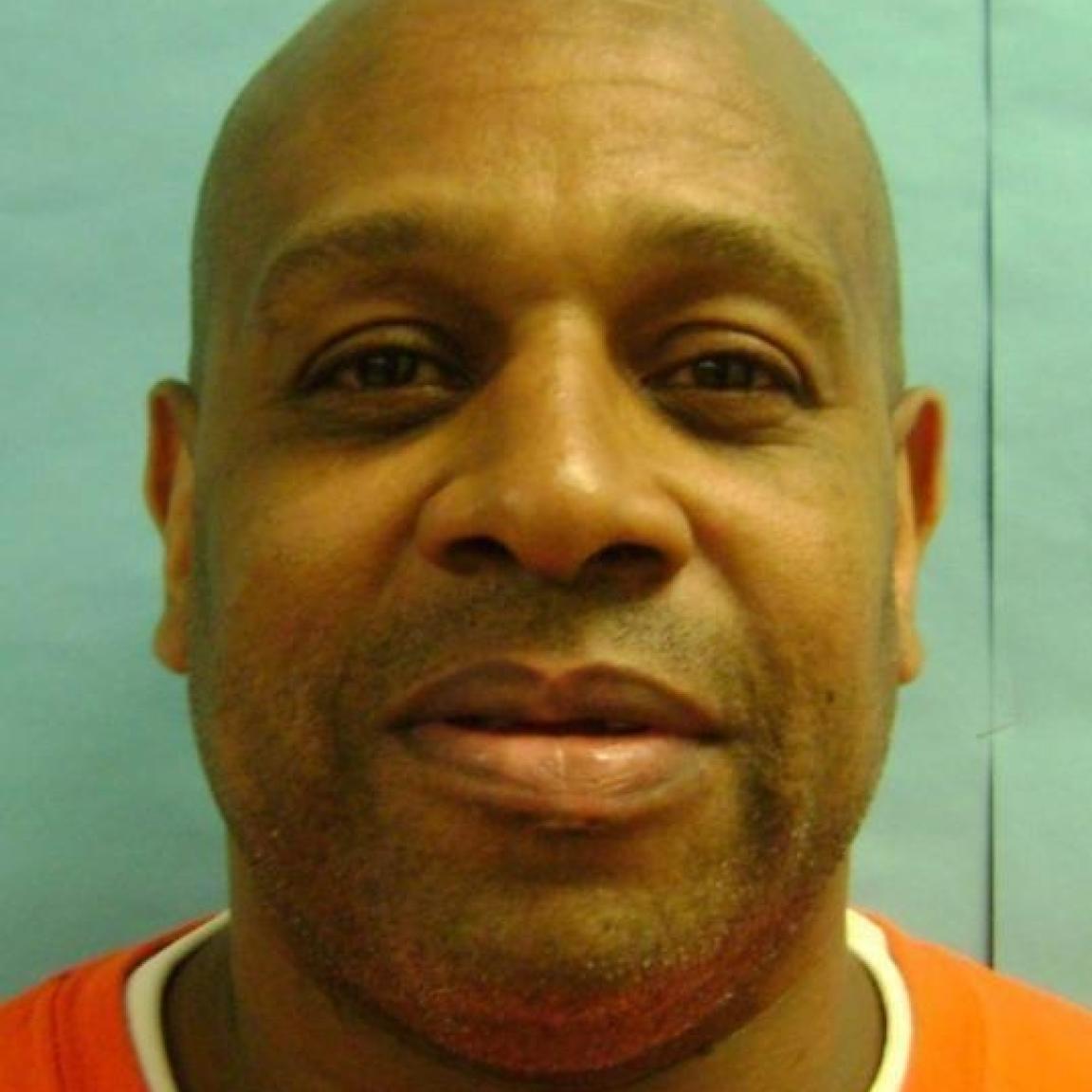 bald overweight black man, slight mustache. 