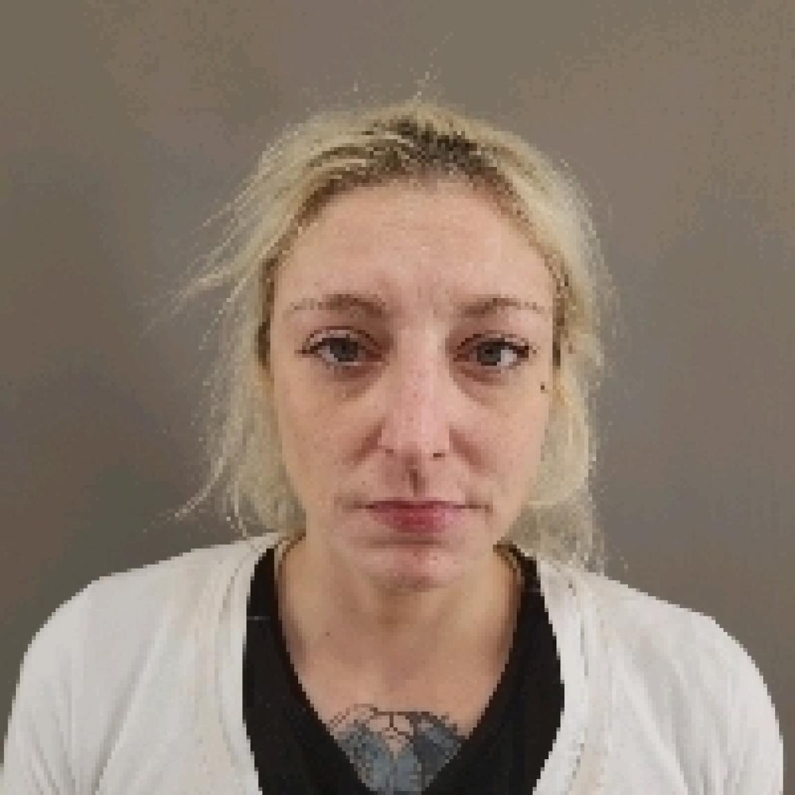 Blonde middle aged woman tatoo on chest