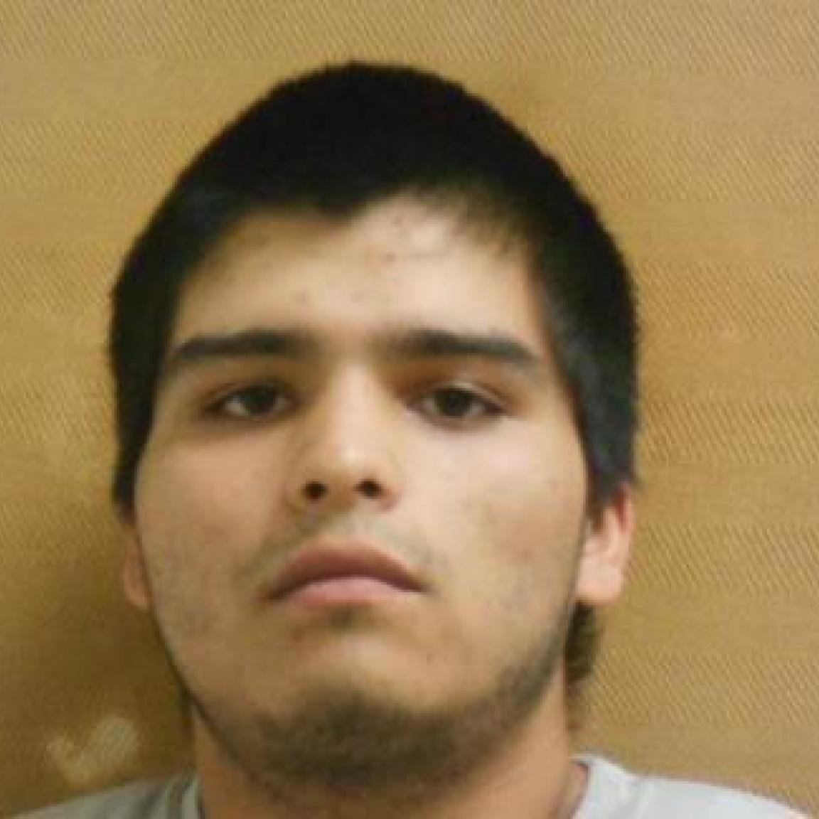 young hispanice man with beard and short black hair