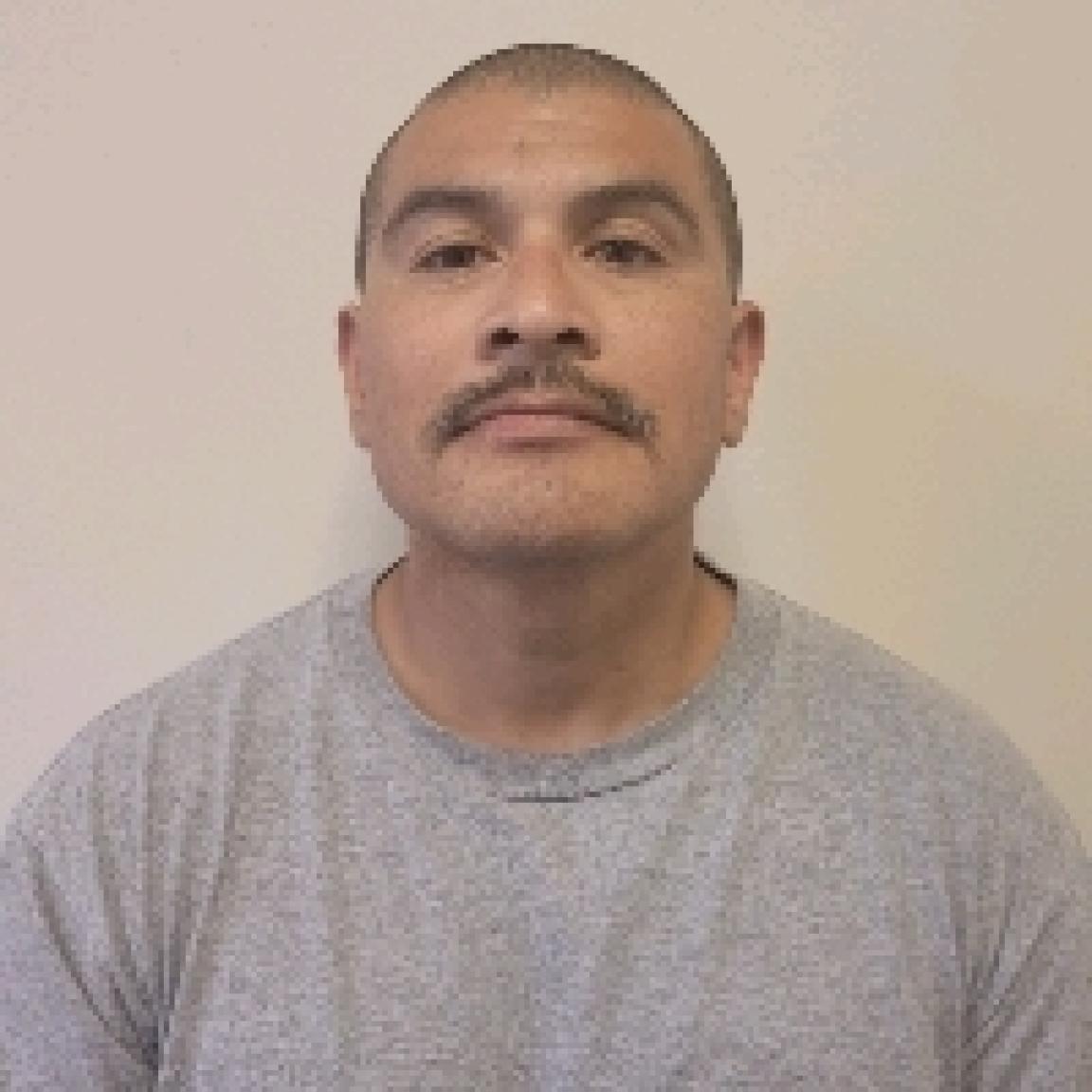 hispanic portly man with mustache