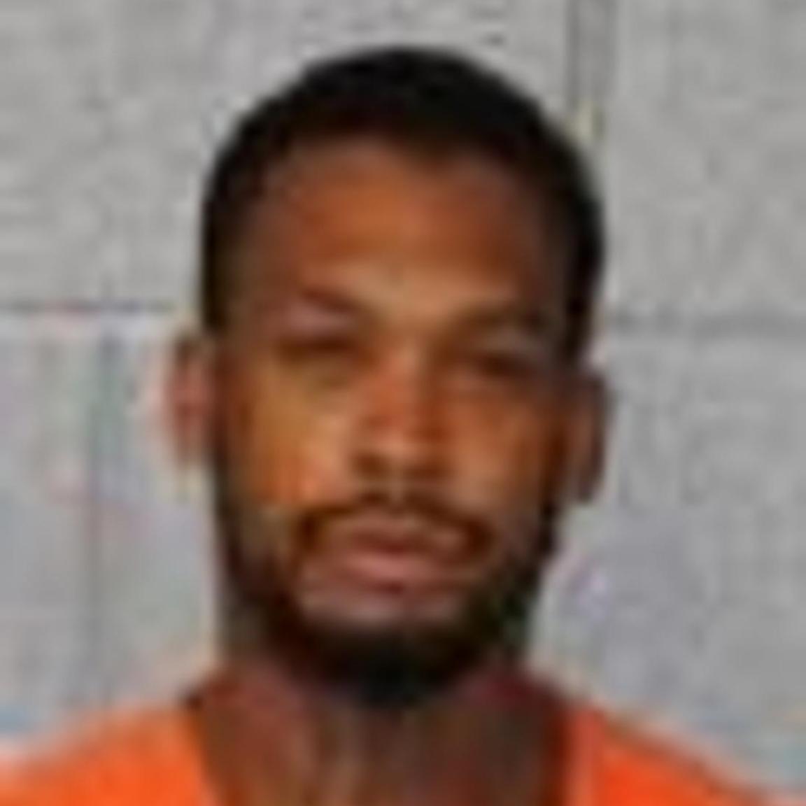 black man with short hair and short beard and short mustache