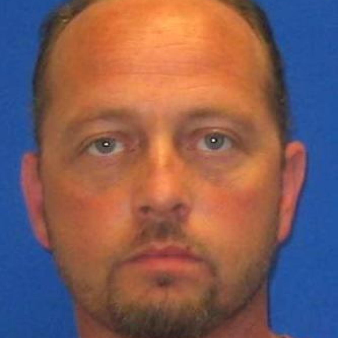 white man with short beard and mustache brown hair