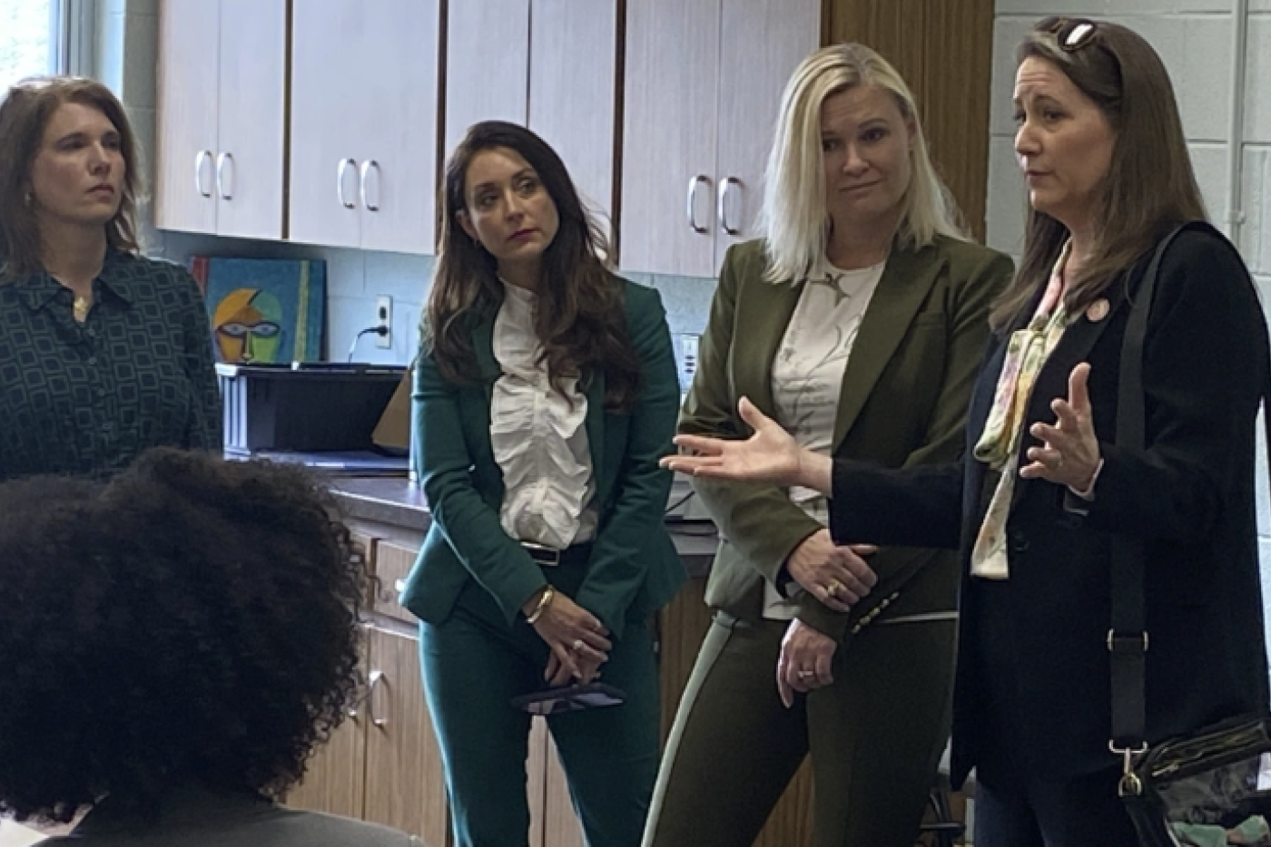 Secretary Leslie Dismukes speaks to three first ladies during a visit to Western Correctional Center for Women