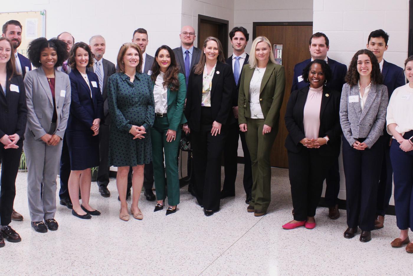 Large group of well dressed men and women at WCCW who participated in the driver license restoration clinics. 