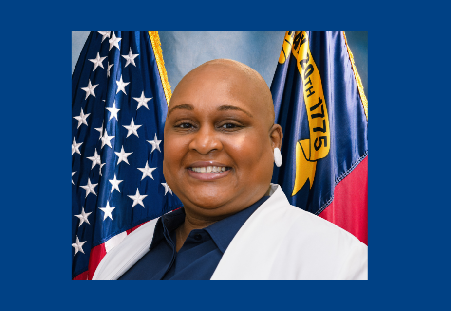 Black woman with white jacket - headshot