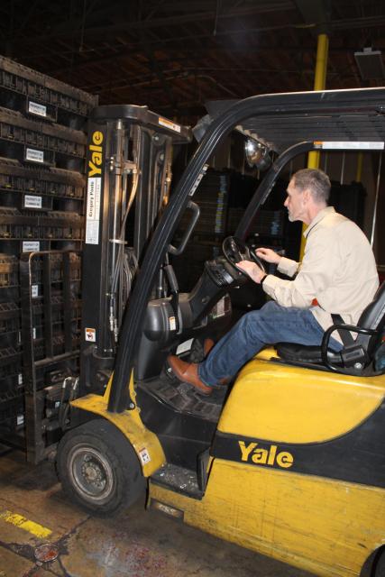 Samuel Hutchins running a forklift in a warehouse