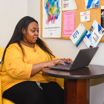 woman working at desk at computer
