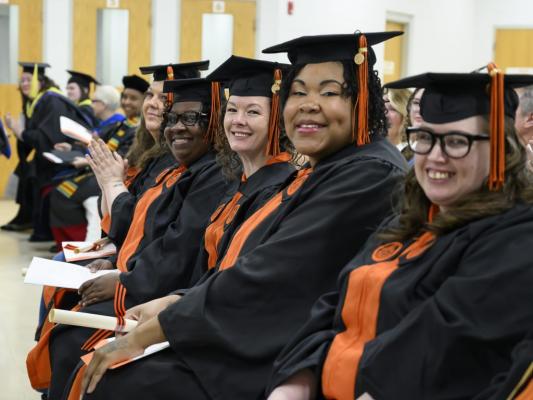 Campbell University graduates smiliing