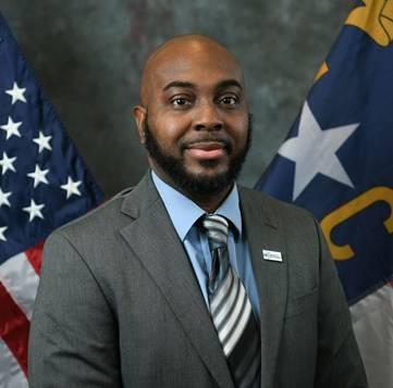 portrait of Charles Raiford before NC and US flags
