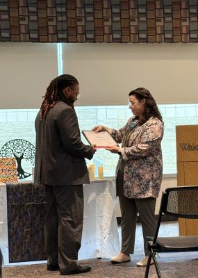 A pilot program participant receives completion certificate