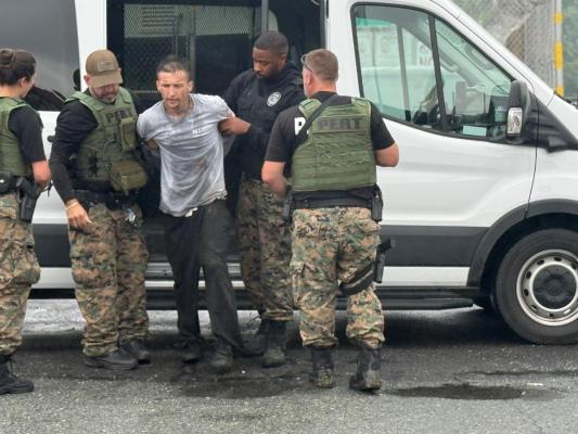 Offender/Escapee Raymond Warren being escorted back to Forsyth Correctional Center by NCDAC staff after being captured. 