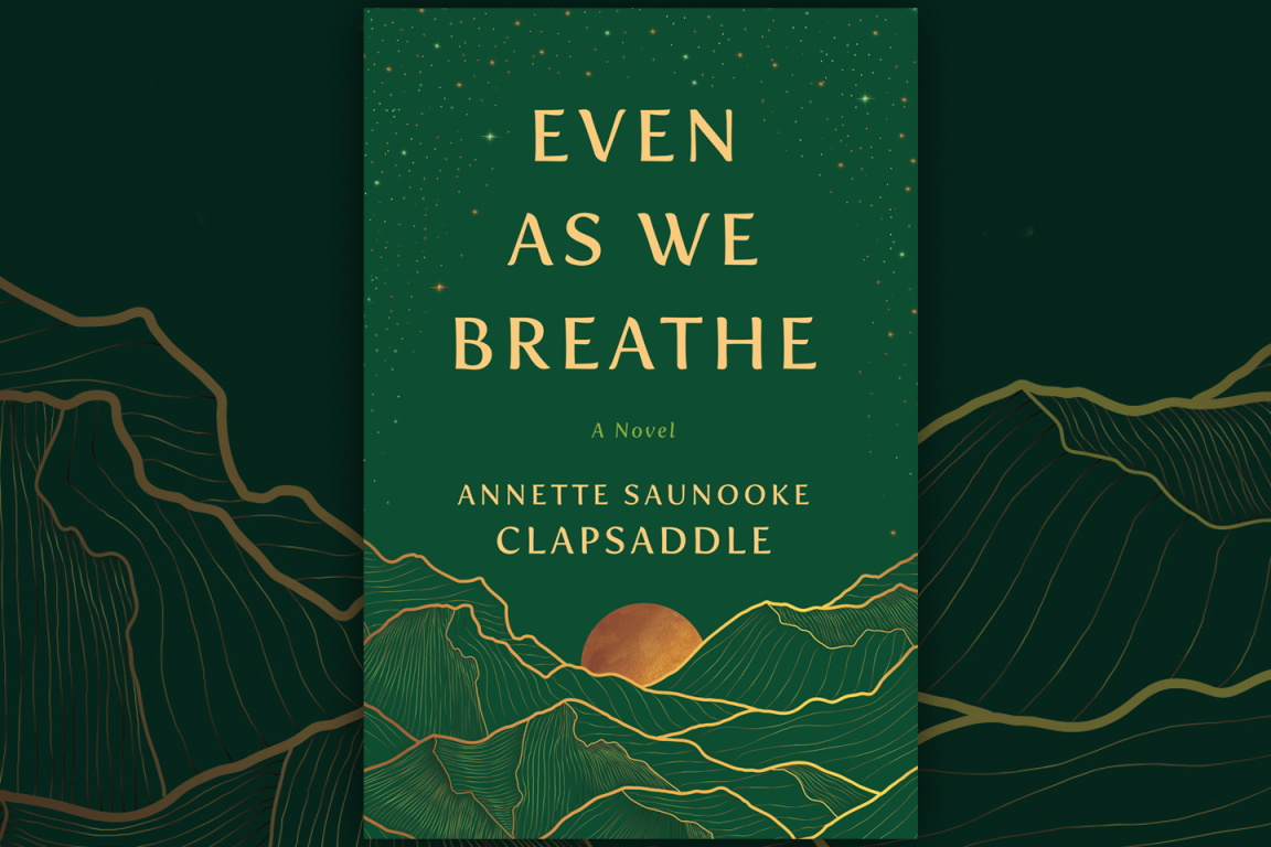 Book cover of "Even As We Breathe" by Annette Saunooke Clapsaddle. The design features a green background with gold illustrations of mountains and a sun, with starry details at the top.