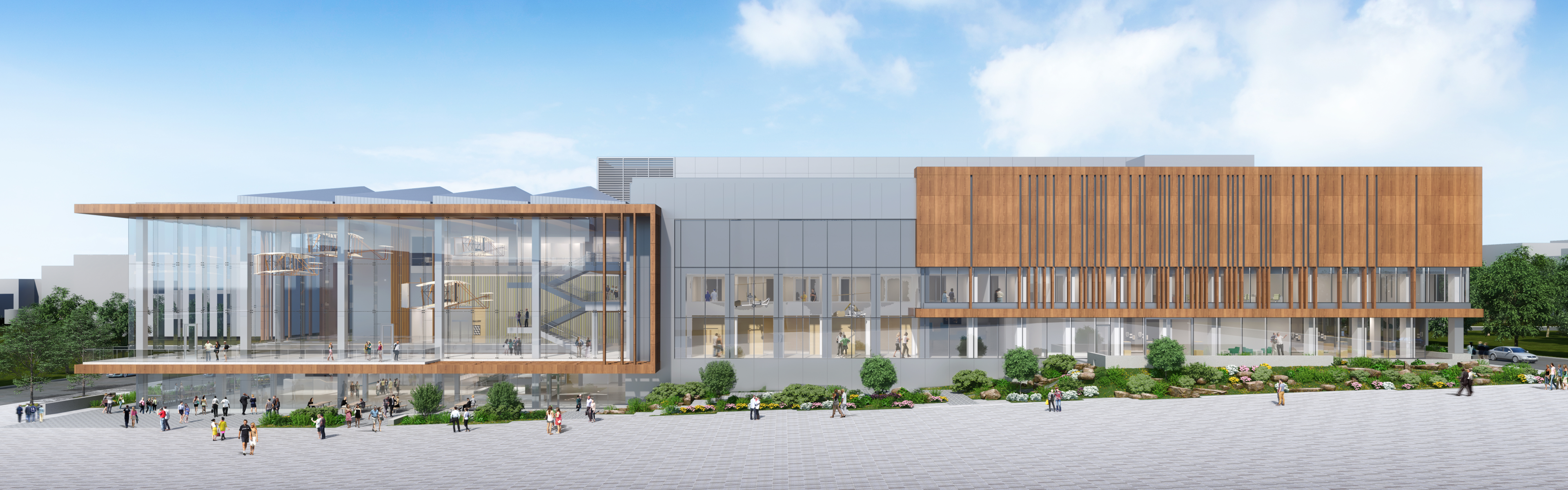 Modern building with glass and wood facades overlooking a pedestrian plaza.