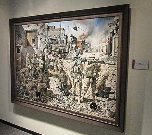 Oil painting displayed on the museum wall featuring a number of modern army soldiers in battle.