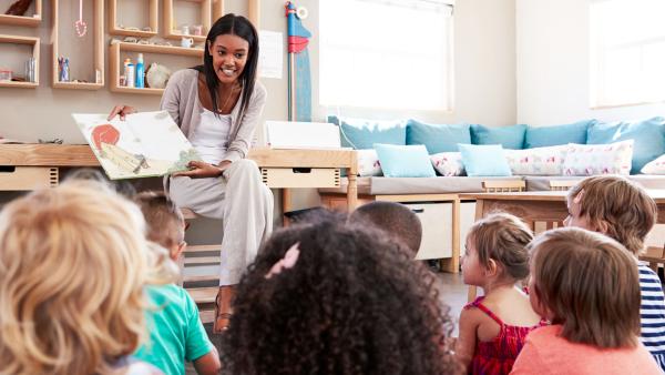 Teacher reads a story to her class