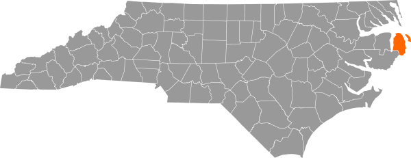 A gray map of North Carolina with Dare County filled in with orange.