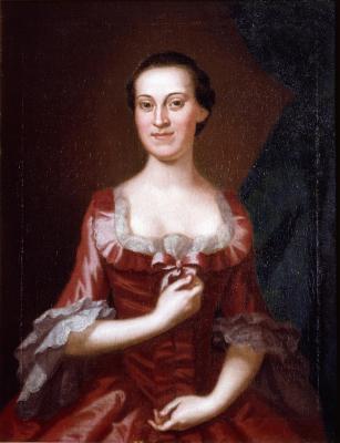 Portrait of a woman wearing a red 18th-century dress with lace trim, seated against a dark background.