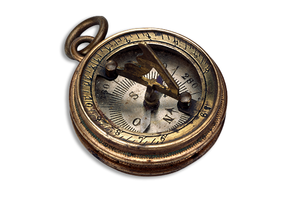 An antique brass compass featuring a sundial raised over the face.