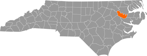 A gray map of North Carolina with Martin County filled in with orange.