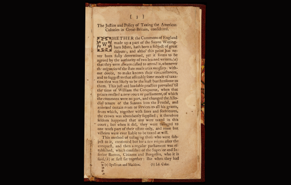 An aged 18th-century pamphlet page titled "The Justice and Policy of Taxing the American Colonies in Great-Britain, considered," featuring archaic typography and a decorative initial "W".
