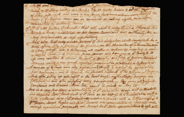 A handwritten document on aged paper featuring dense cursive script that outlines various "Decrees."