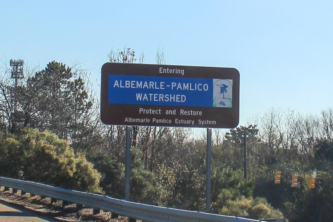 Highway sign stating "Entering the Albemarle-Pamlico Watershed."