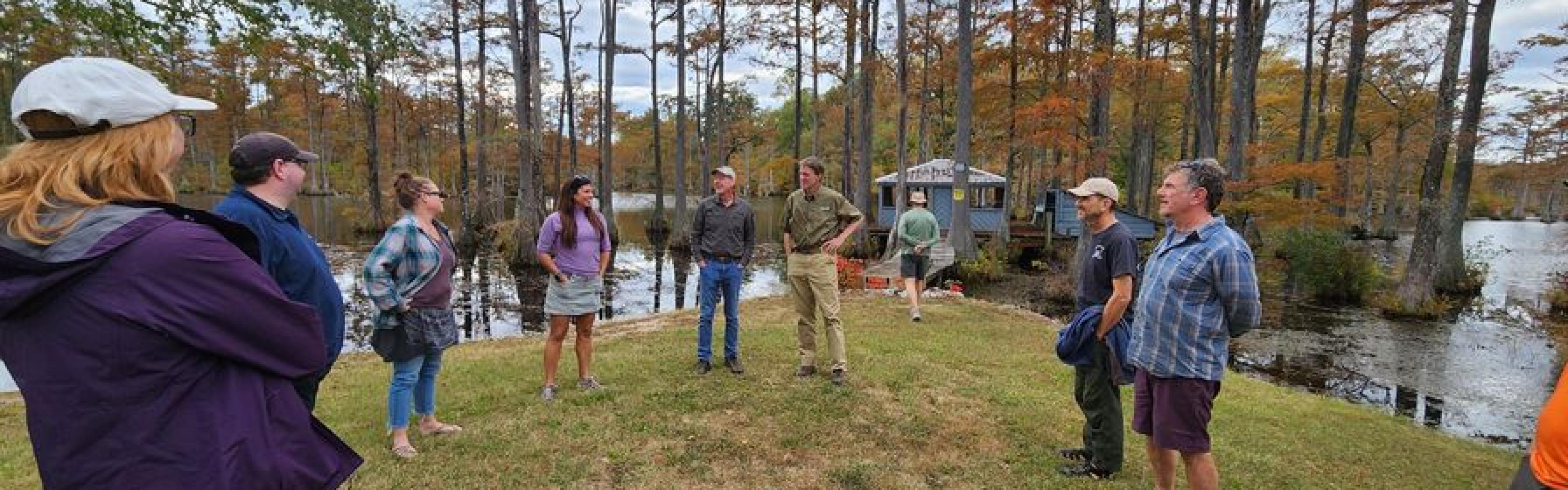 picture of people near a swamp