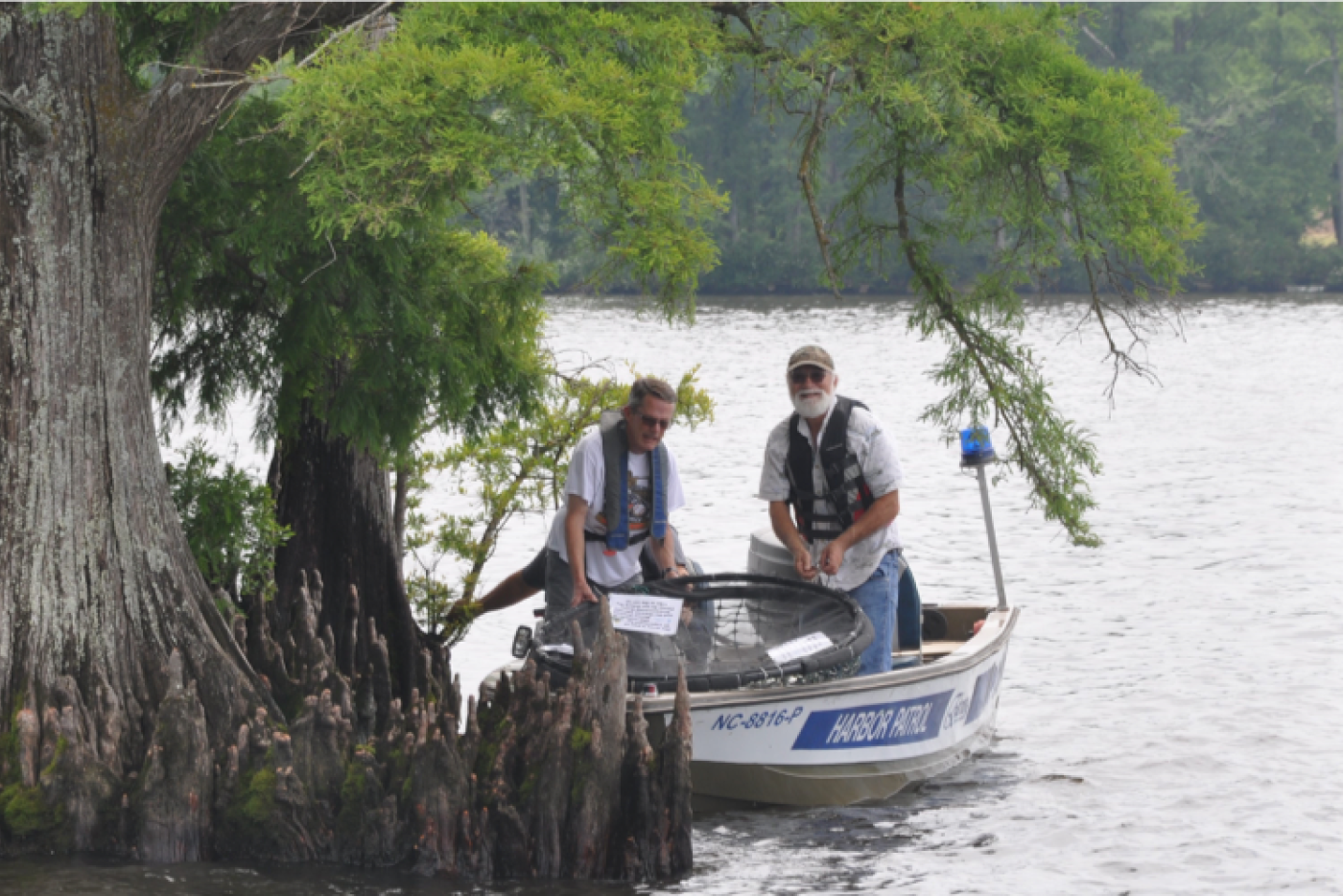 citizen scientists monitoring in a boat
