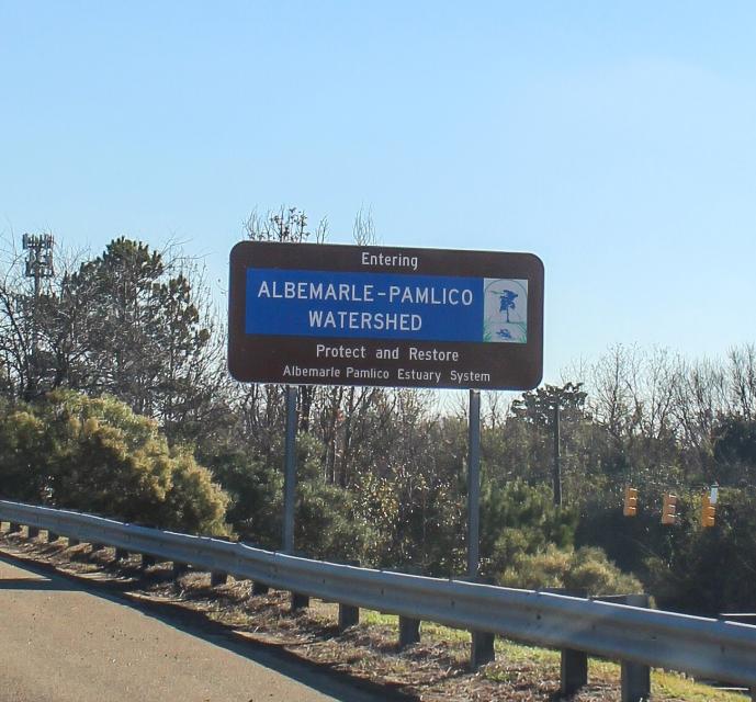 Highway sign stating "Entering the Albemarle-Pamlico Watershed."
