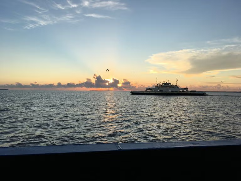 Ferry on the water with sunset