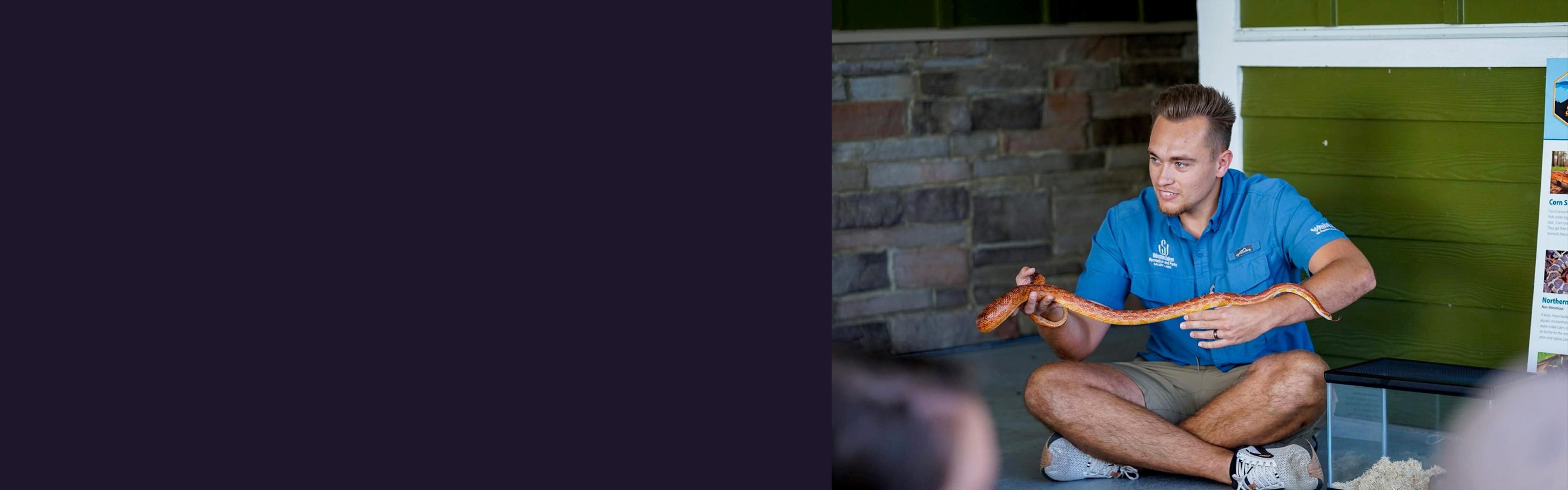 Cody Orman holding a snake