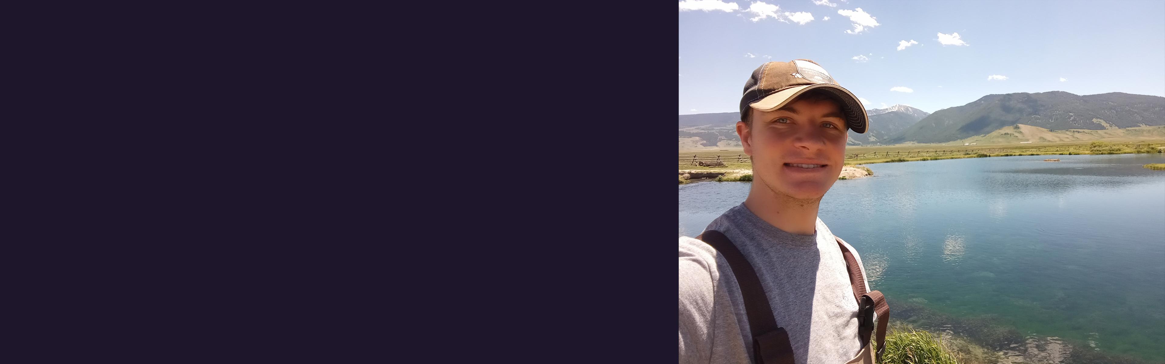 Seth Landon standing in front of a body of water