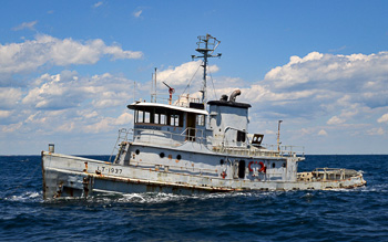 tugboat being sunk for an artificial reef