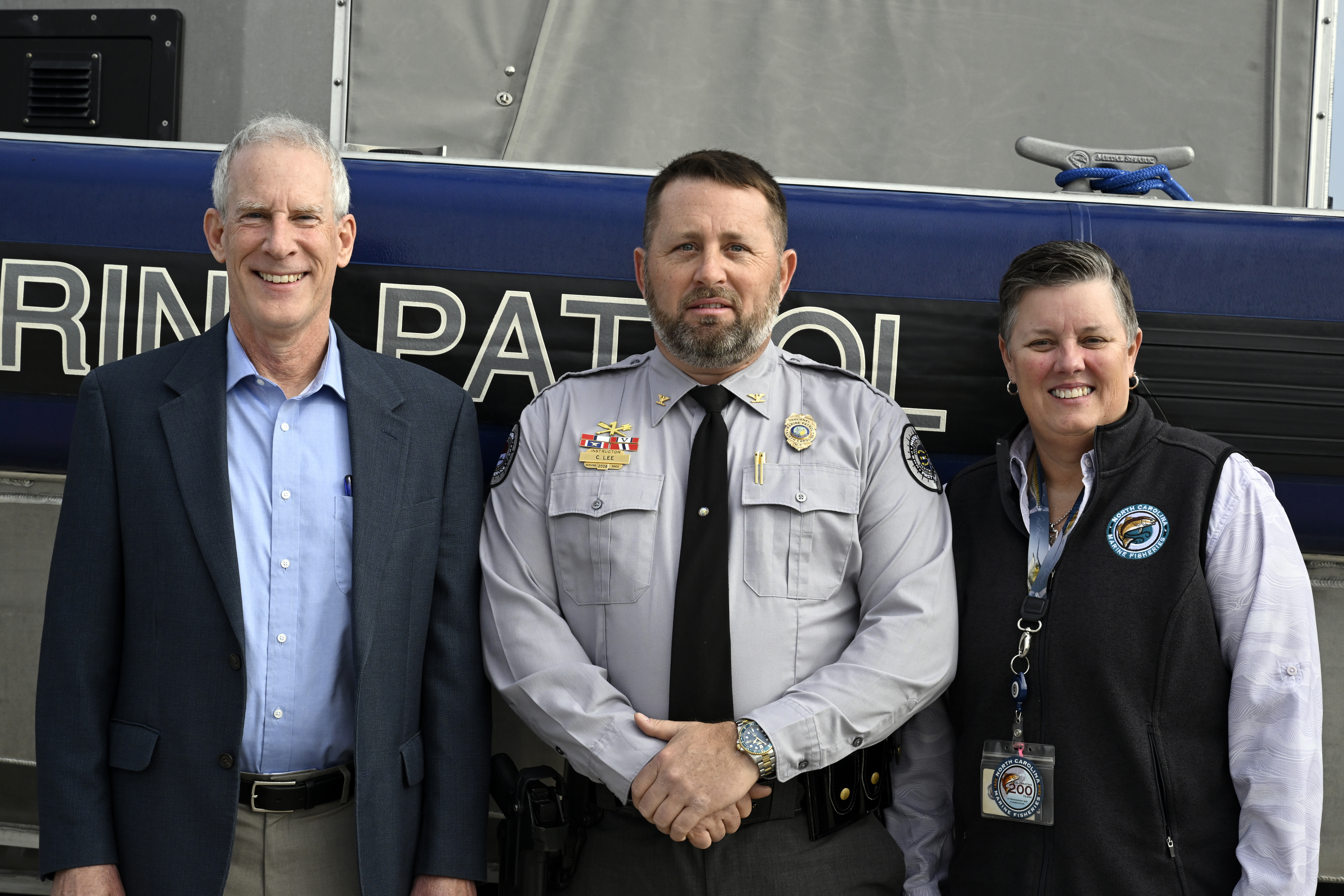 Chris Lee with Secretary Reid Wilson and DMF Director Kathy Rawls