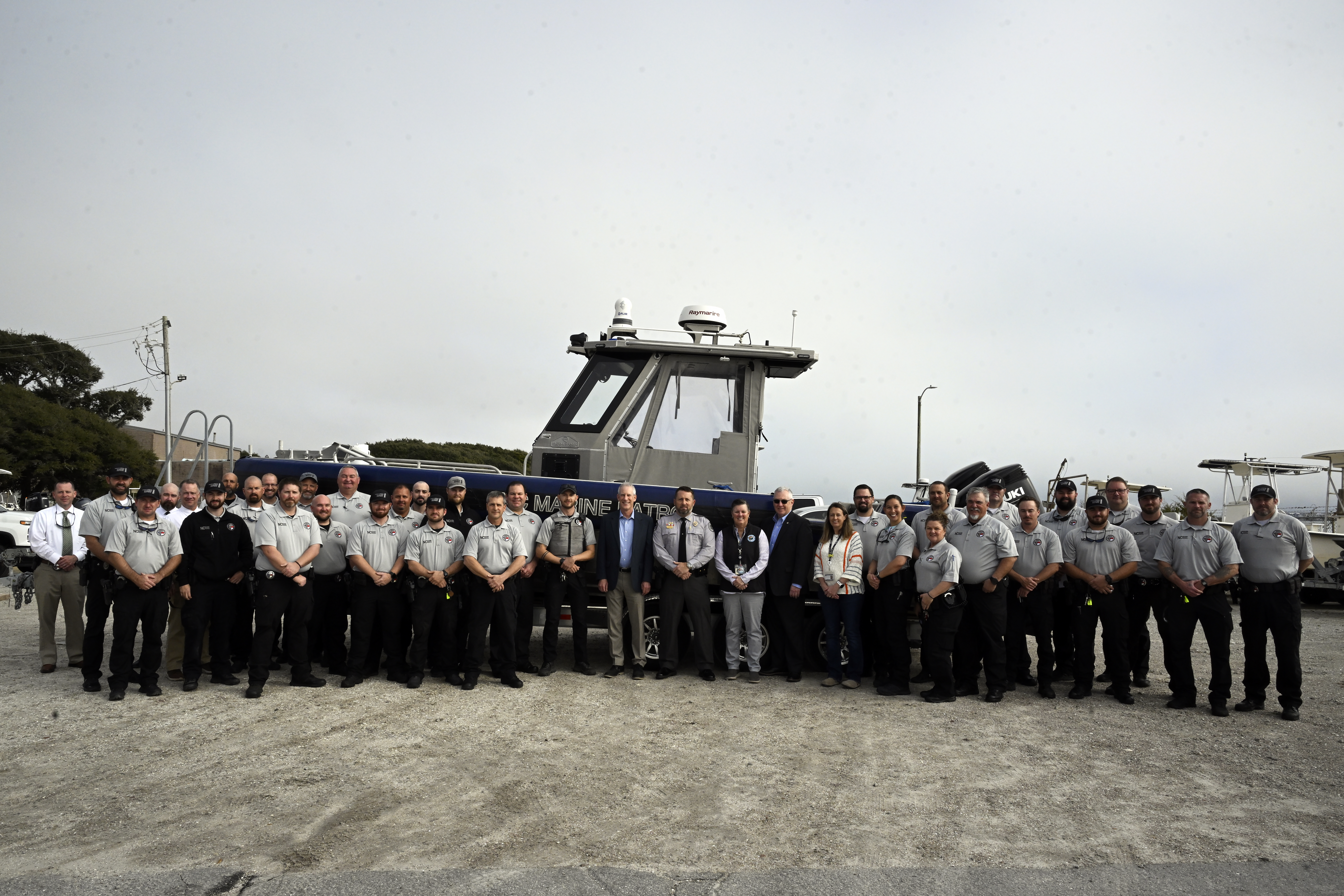 Large group photo of Marine Patrol with Secretary Reid Wilson and Kathy Rawls
