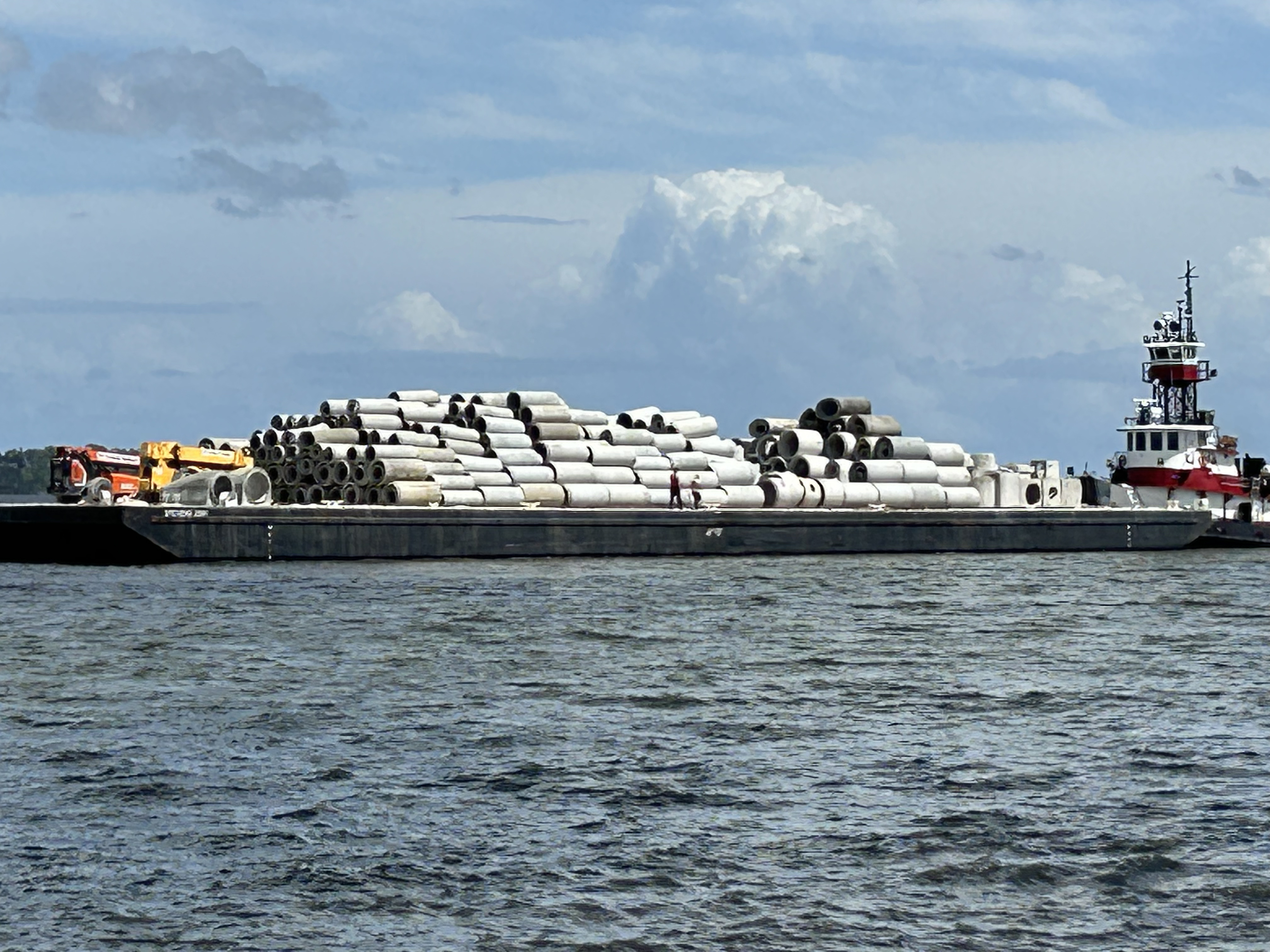Photo of concrete pipe and squares loaded on a vessel for deployment onto the artificial reefs.