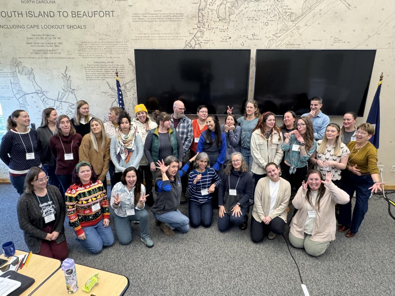 Large group smiling for a photo and making silly faces
