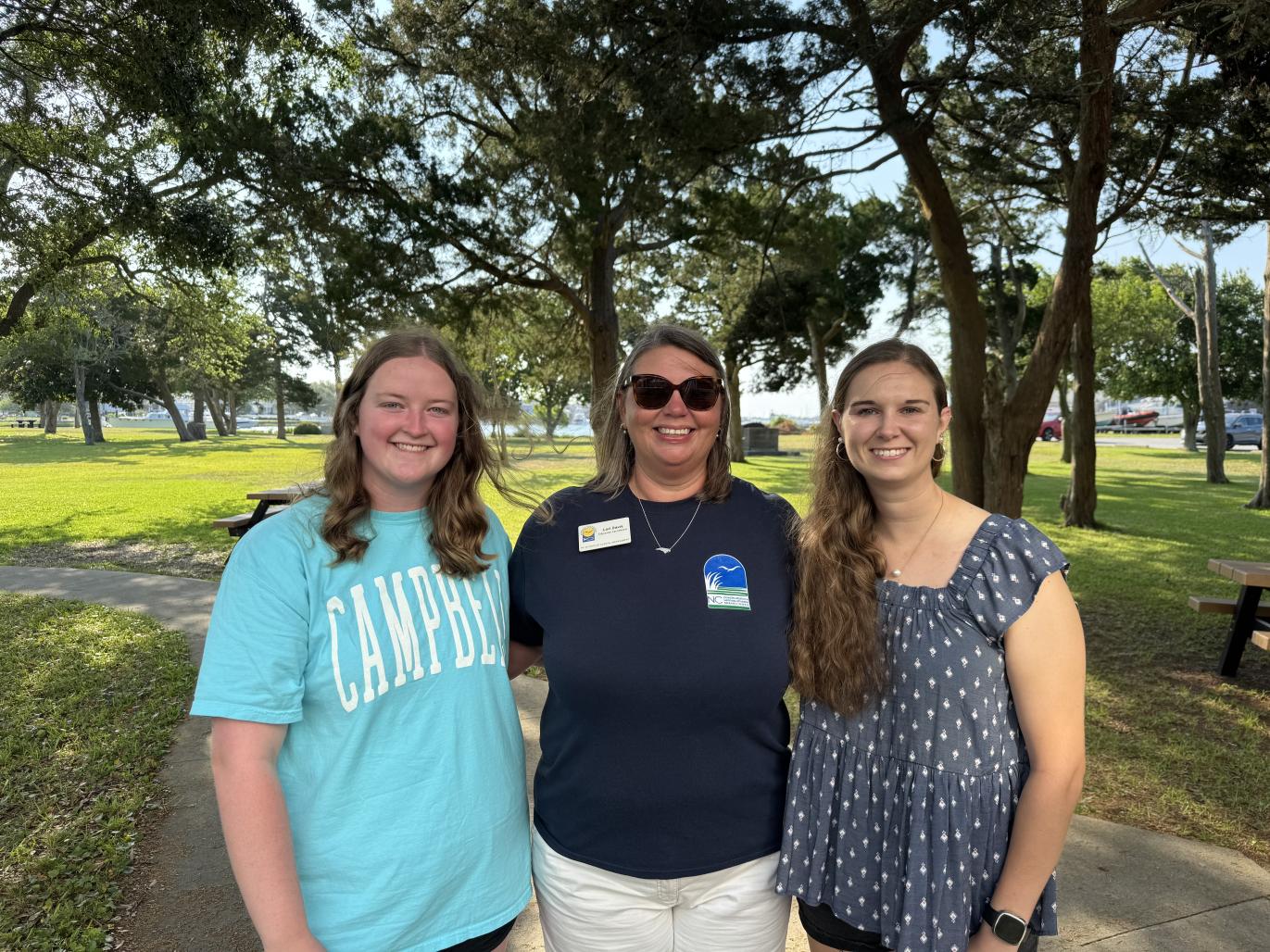 Janina Millis, Lori Davis, and Jenna Mclamb stand together in Beaufort