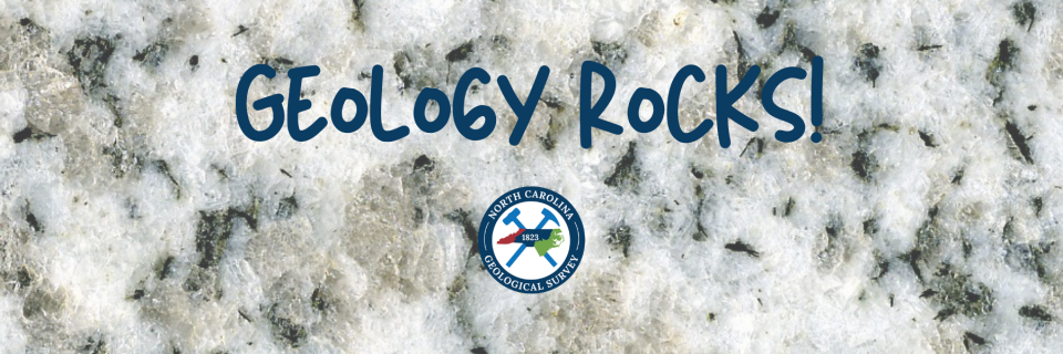 Small sample of Mt. Airy granite with Geology Rocks written overtop along with the NCGS logo