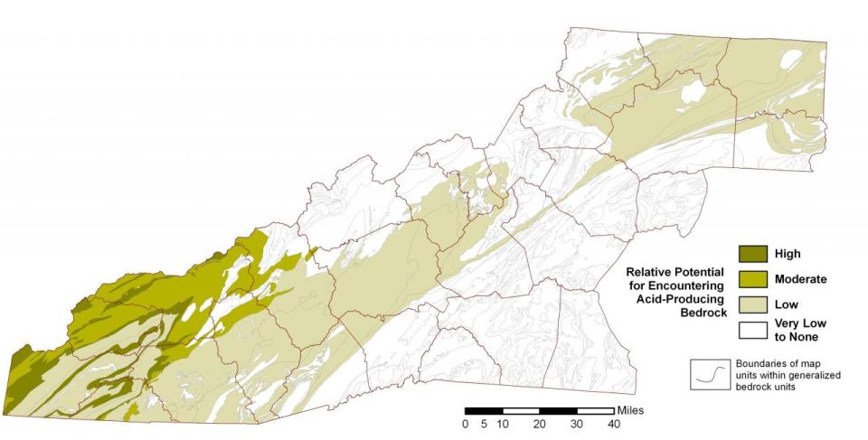 A map with NC counties in the Blue Ridge. Variations of green colors show the relative potential for acid producing rocks. High potential in the southwest and lower potential to the northeast.