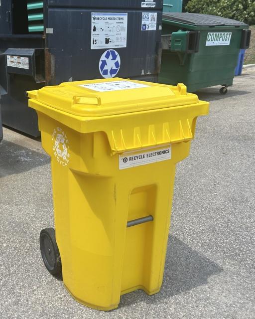 A yellow electronics recycling cart.