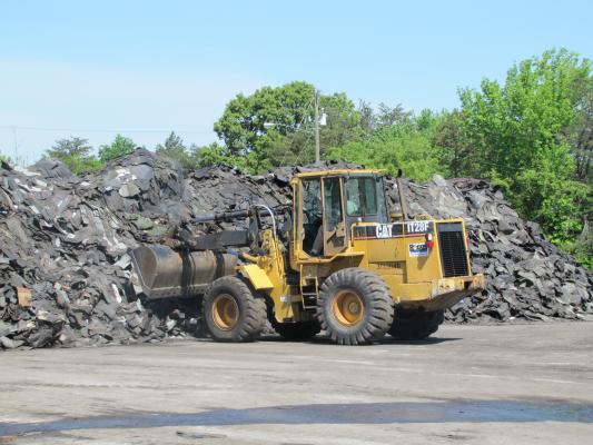 Tractor Truck picking up some Post Consumer Recycled Asphalt Shingles 