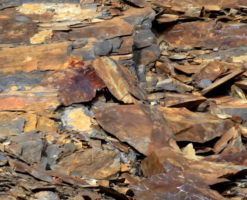 Brown, red, and rust colored rocks along the Blue Ridge Parkway in North Carolina