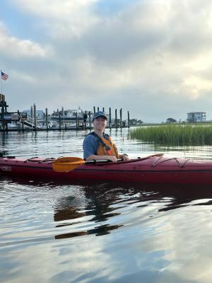 Person smiling in a kayak